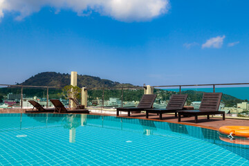 Fototapeta na wymiar Pool on the roof of the hotel on the terrace at patong beach in phuket island; thailand