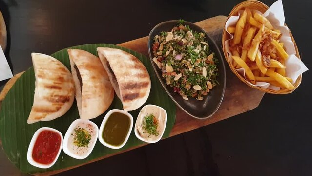 Minced lamb kebab stuff in pita bread with tabouli salad and fries Labanese Arabic food