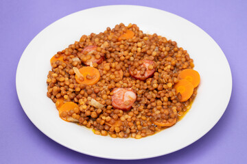 Lentils with chorizo and carrot. Typical Spanish recipe.