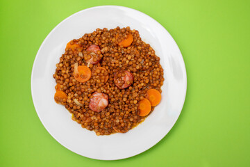 Lentils with chorizo and carrot. Typical Spanish recipe.