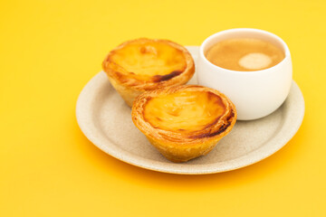 Egg tart, traditional Portuguese dessert, pastel de nata and coffee