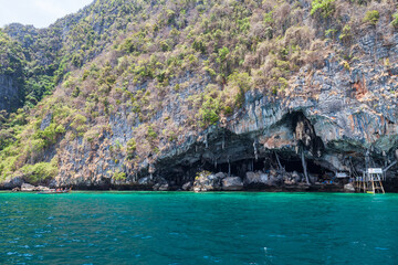Viking caves on Phi Phi Le island in the Andaman Sea with pirates hiding treasures. Travel and excursions in Thailand Phuket island.