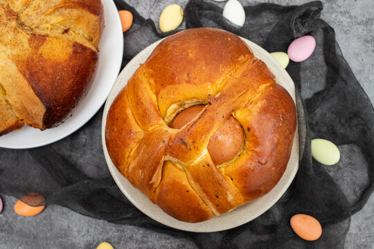Fresh portuguese Easter folar with egg on dish