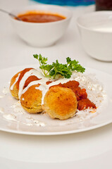 Homemade falafel dish with rice, yogurt and parsley. Falafel is meatless food made of garlic, onion, parsley and chickpeas.