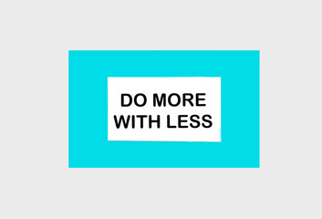 Do more with less. text on a green notepad on a light background