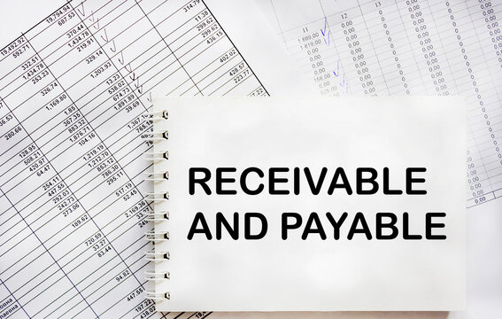 Business concept. On documents with reports, a notepad with the inscription - Accounts receivable and accounts payable