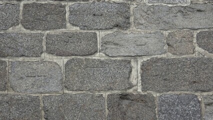 Detail of a stone wall with different size of rocks.