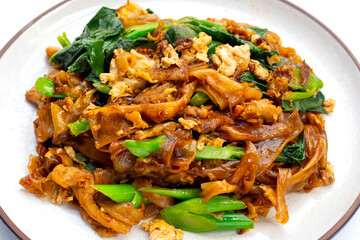 Stir-fried rice noodles with soy sauce and pork
