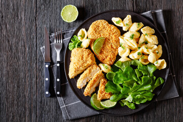breaded chicken fillet with alfredo pasta shells
