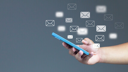 Mail icon notification concept on smartphone Contact us via email newsletters and protect your personal information from spam mails. Customer Service Center Contact Us Email Marketing and Newsletters