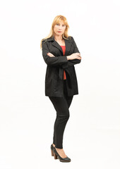 blonde businesswoman dressed in black with her elbows crossed on a white background