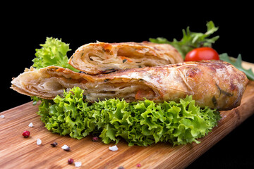 Baked Suluguni cheese wrapped in Lavash bread with fresh vegetables