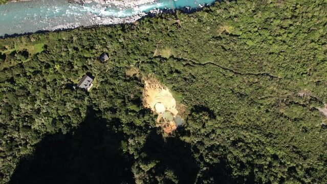Aerial view of Welcome Flat Hut and hot pools, Copland River track in New Zealand, beautiful landscape.