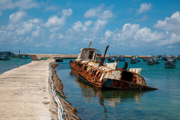a rusty shipwreck on the beach