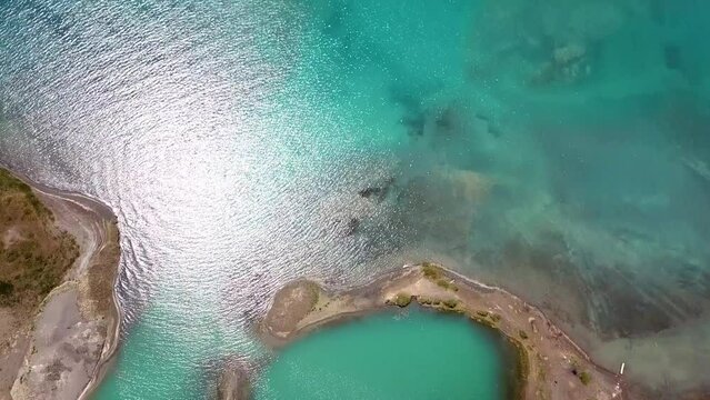 Aerial view of lake shore with beautiful turquoise water