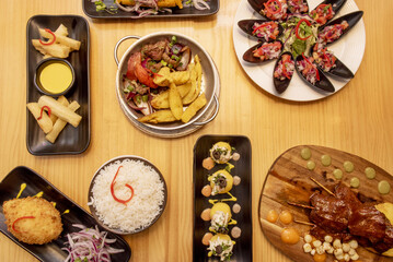 Set of colorful Peruvian food dishes with fresh mussels,