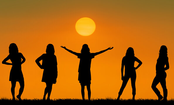 Active and happy young girls on sunset background