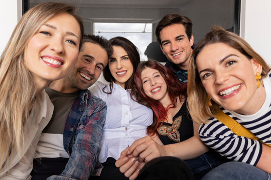 group of young millennial caucasian and hispanic friends, making selfie at home