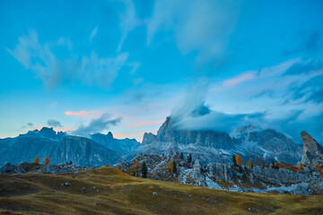 cloudy evening at Cinque Torri mountain range in Italian Dolomites