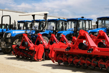 Lots of modern new tractors and additional tillage equipment. © SKfoto