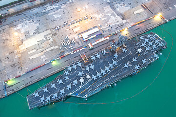 Aerial view army navy nuclear ship carrier full fighter jet aircraft concept technology of battleship.