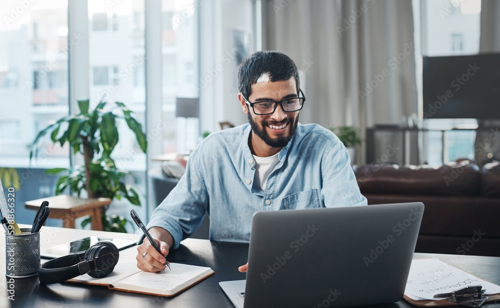 Poster i actually prefer working from home. a young man using his laptop while working from home.
