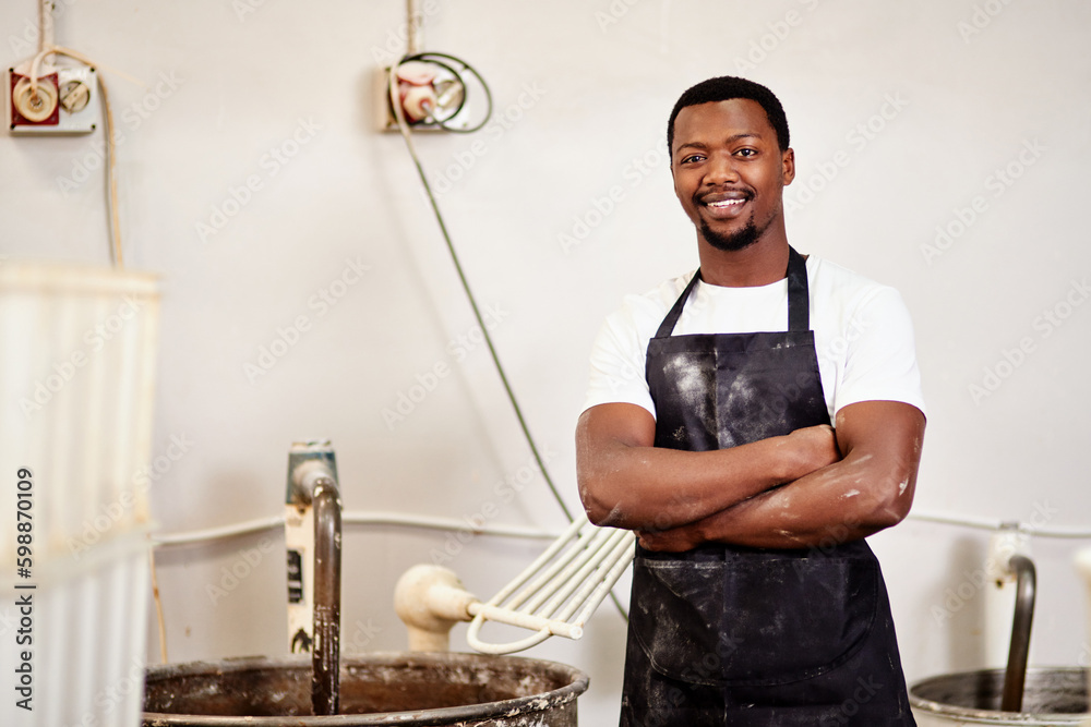 Poster my bakery is worth a try. a confident young man working in a bakery.