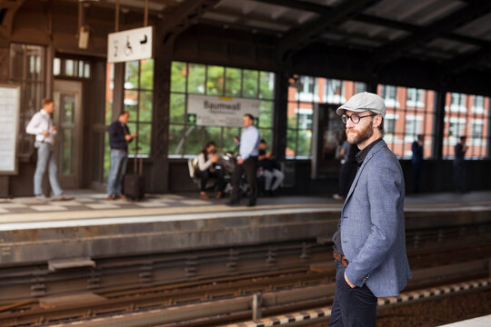 Man standing on railway station platform