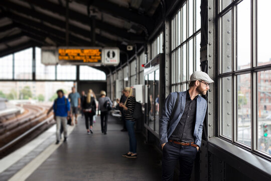 Man standing on railway station platform