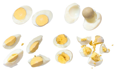 Set of hard boiled egg cut in halves and chopped isolated on white background 