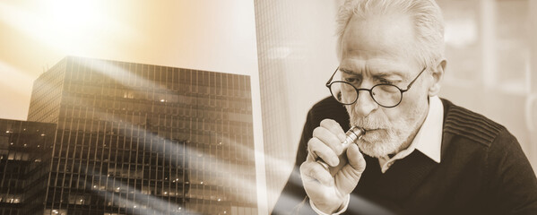 Senior man smoking electronic cigarette; multiple exposure