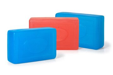 Three pieces of red and blue toilet soap on a white background. Full depth of field. With clipping path