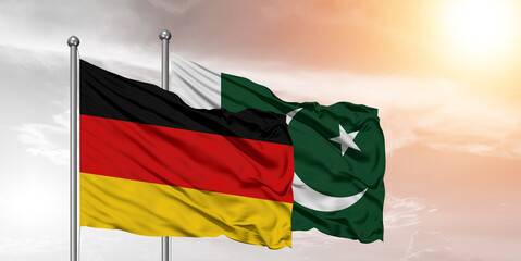 Flags of Pakistan and Germany friendship flag waving on the sky with beautiful Background.