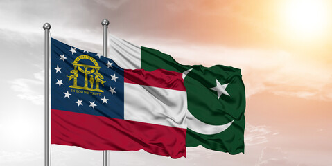 Flags of Pakistan and Georgia friendship flag waving on the sky with beautiful Background.