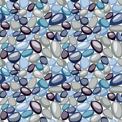 Seamless texture of small pebbles. Colorful stones on the ground. Top view of Natural colorful gravel