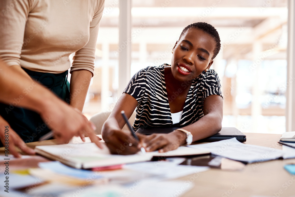 Poster creativity solves problems faster and easier. a young businesswoman working with her colleagues in a