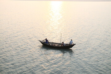 boat on the sea at sunset