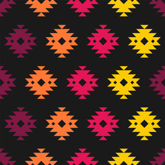Seamless pattern with colorful aztec design and black background