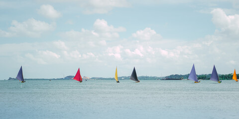 Sailboats race in Riau sea within the framework of local fisherman traditions