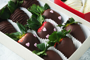 Gourmet chocolate covered strawberries on the light background.