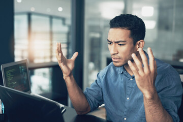 If youre scared to take chances, howll we get rich. a young frustrated man making hopeless gestures while using a laptop in a modern office.
