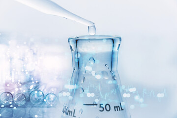 water drop with pipet in to glass flask in blue medical research science laboratory and graph information background