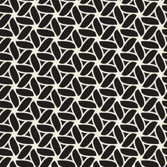 Seamless geometric leaves pattern. Black and white abstract decorative background to be used as a texture for decorative, textile, and wrapping projects. Vector illustration.