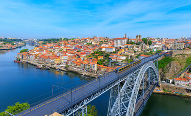 Fototapeta na wymiar Panoramic cityscape of Porto- Portugal with famous Luiz Bridge and Douro river