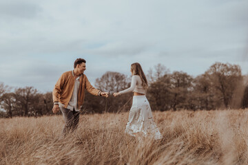 happy couple in the park on a beautiful sunny day