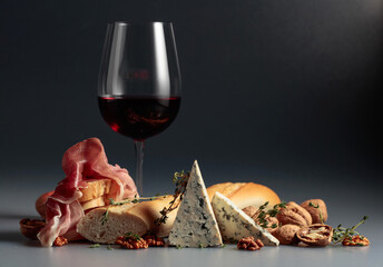 Red wine with traditional Mediterranean snacks.