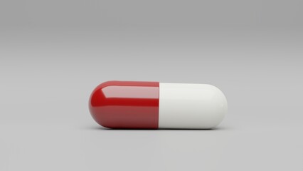 Red white capsule pill on a white background - Medicine healthcare medicaments