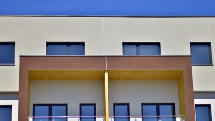 Modern apartment buildings on a sunny day with a blue sky. Facade of a modern apartment building. Contemporary residential building exterior in the daylight. 