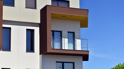 Modern apartment buildings on a sunny day with a blue sky. Facade of a modern apartment building. Contemporary residential building exterior in the daylight. 