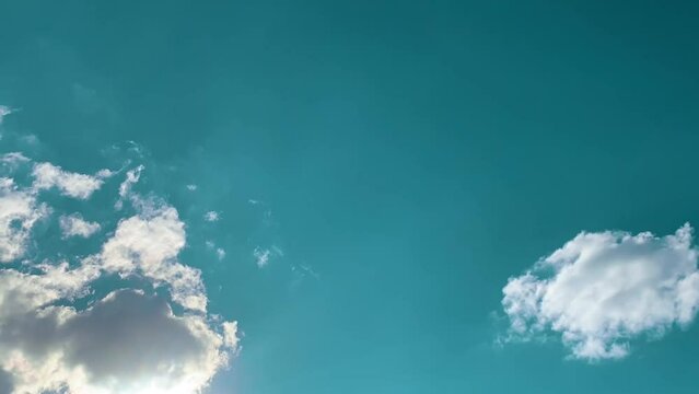 Blue sky white clouds. Puffy fluffy white clouds. Cumulus cloud cloudscape Timelapse. Summer blue sky time lapse. Nature weather blue sky. White clouds background. Cloud time lapse , video loop